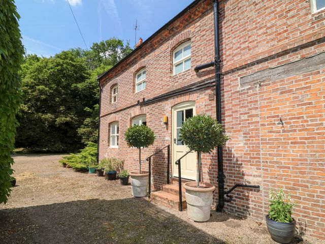 An exterior view of a house with plants and steps at The Old Barn in Caenby near Market Rasen