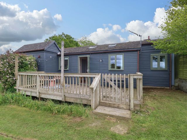 An exterior view of a house with a deck at Foxglove in King's Lynn