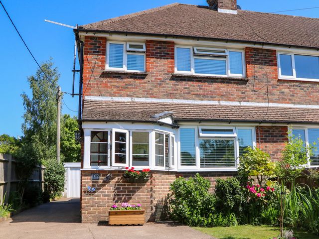 A house with garden and pathway at Lavender Cottage in Hailsham
