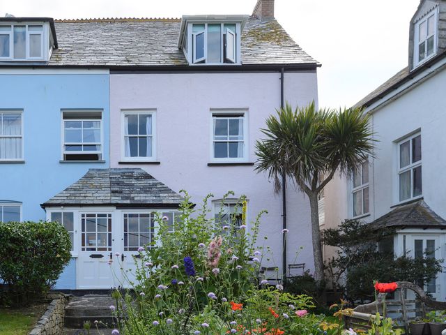 A house with a garden and flowers at 84 Fore Street Port Isaac