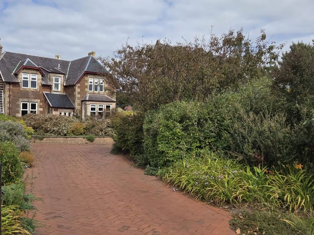 A house with a garden and pathway at The Old Rectory Largs