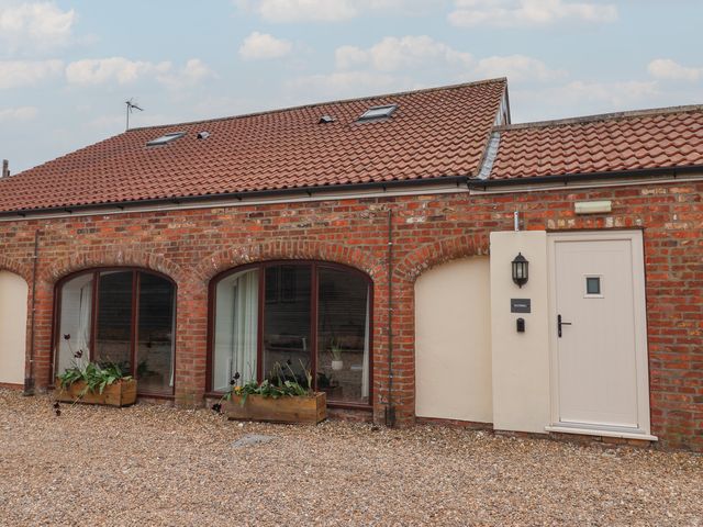 A building with windows and a door at Razorbill in Flamborough