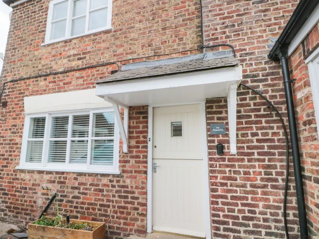 An entrance with a front door and a planter at The Pheasantry in Flamborough