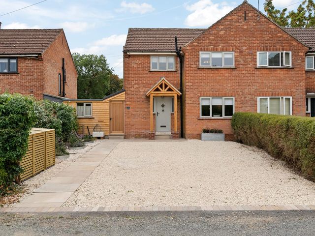 A house with gravel driveway and hedge at 3 Olivers View Brandsby