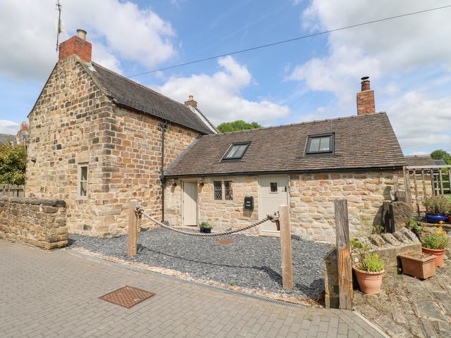 A stone house with a gravel area and plants outside at 33 Main Road Higham Derbyshire