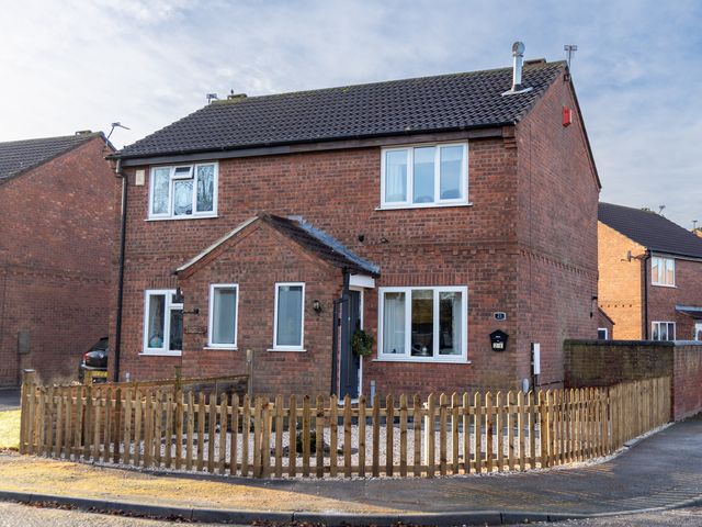A house with a fence and garden at Deer Hill Grove in York