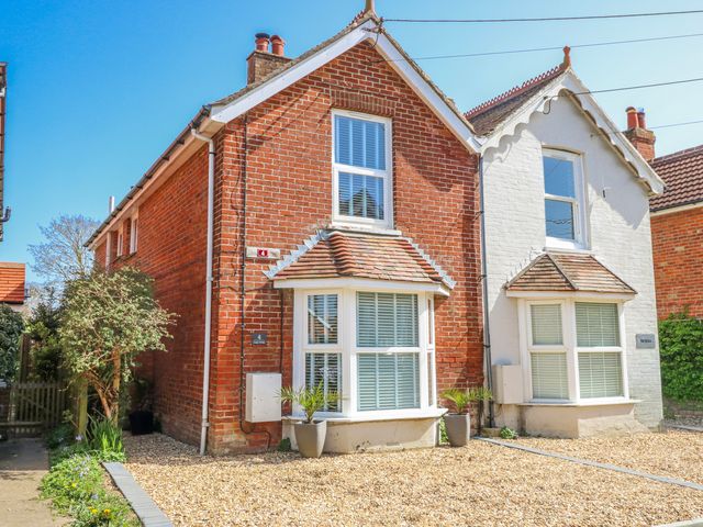 A house with windows and gravel at 4 Copse Lane in Freshwater