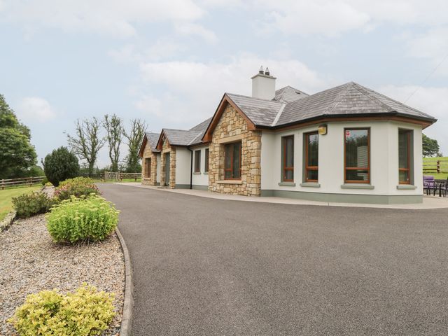 A house with stone features and a driveway at Swan Lake Cloonshaghan near Boyle, County Roscommon