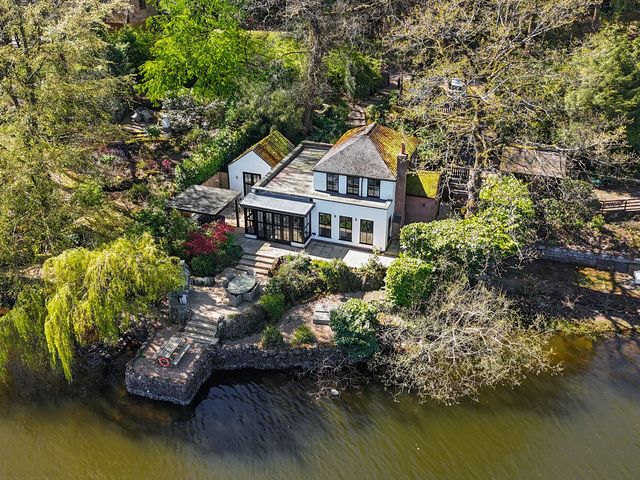 A house with garden by the water at The Sheiling Rudyard Lake