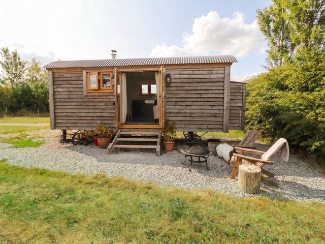 A trailer with steps and seating area at Cariad Mawr in Gwaenysgor near Prestatyn