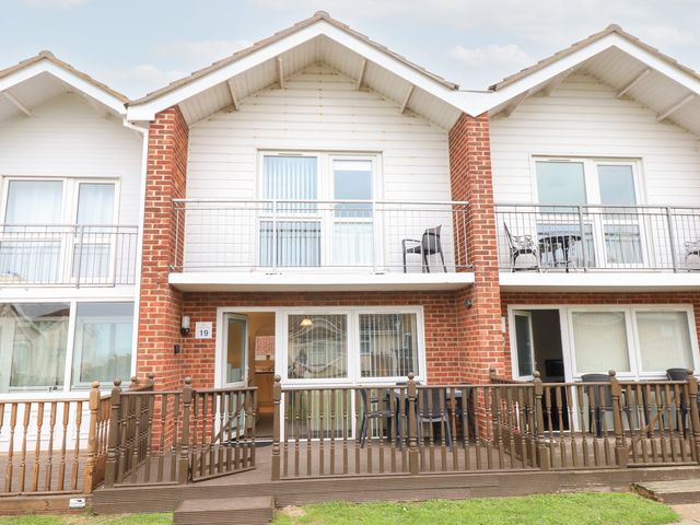 An outdoor view of a house with balconies at 19 Waterside Park in Corton