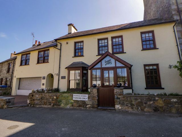 A building featuring a parking area at Parrog Bach in Parrog near Newport, Pembrokeshire