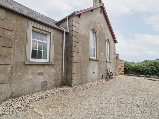 An exterior view of the property with a bicycle near the wall at Crea The Mission Hall near Ballymena