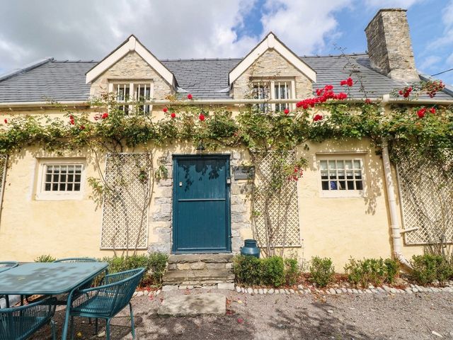 A house exterior with a door and windows at The Cheese House at Gileston Manor near St Athan