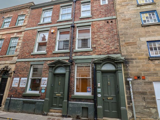 A building facade with doors and windows at Jolly Roger in Whitby