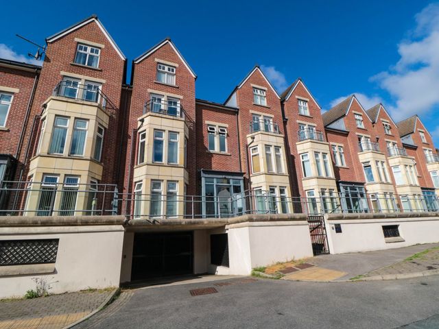 A residential building with balconies and windows at Flat 17 in 