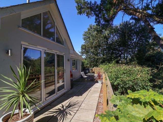 An outdoor area with a sliding glass door and seating at Seagrass in Bideford