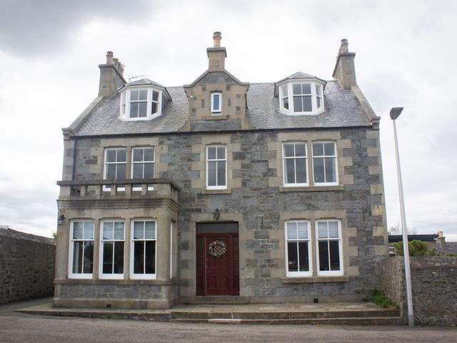 A house with multiple windows and a front door at Crannoch Self Catering Buckie