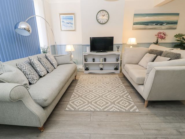 A living room with two sofas and a television stand at Delightful Dorset House By Wareham River, Wareham