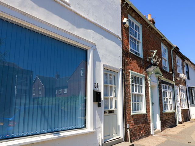 A row of buildings with a window and door at Delightful Dorset House By Wareham River, Wareham