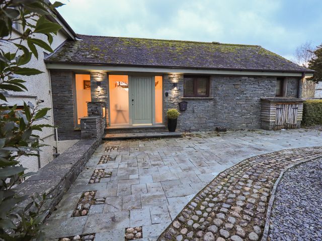 A building entrance with a front door and pathway at Haystacks in Troutbeck