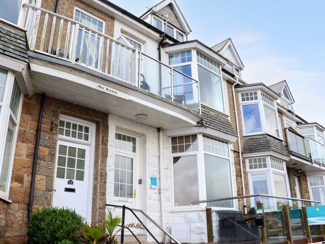 Exterior view of a row of houses with balconies and bay windows at Mor Kernow in St Ives