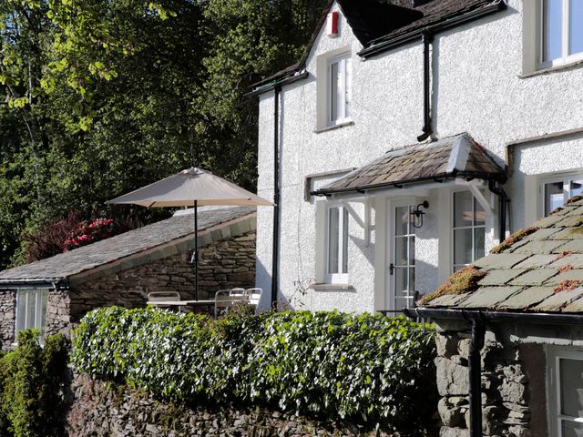 A house with a parasol and garden details at Brockstone in Grasmere