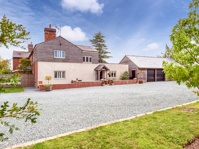 A house with a garage and gravel driveway at Yocking Gate Mews near Whitchurch