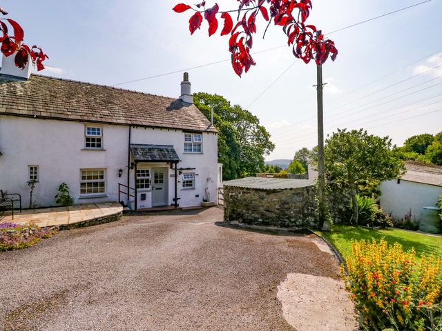 A house with garden and pathway at Burnbank Cottage in Grange-Over-Sands