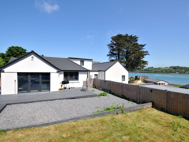 A house with a deck and gravel area at The Mooring in Northam