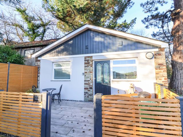 A building with a door and patio at Tarka View in Bideford