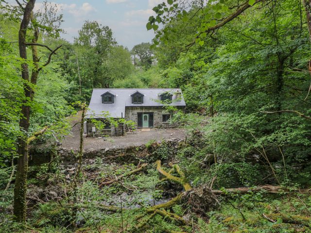 A house surrounded by trees at Frongoch Old Power House in Dolgellau