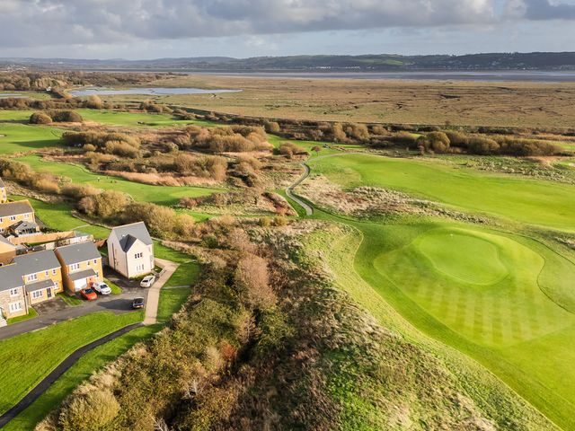 An aerial view of a golf course and residential area at 69 Ffordd Y Meillion Llanelli