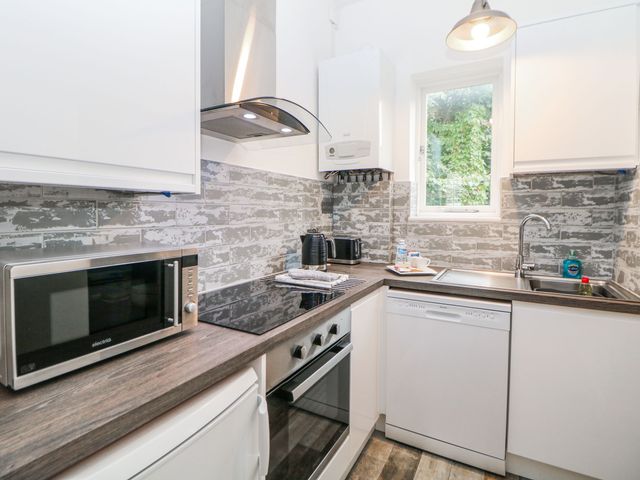 A kitchen with appliances including a microwave and an oven at Riber in Matlock Bath