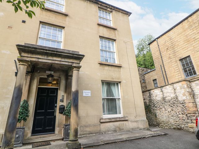 A residential building entrance with a sign at Derwent View in Matlock Bath