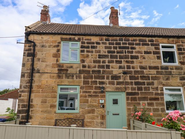 A house exterior with stone walls and windows at 7 St. Germains Lane