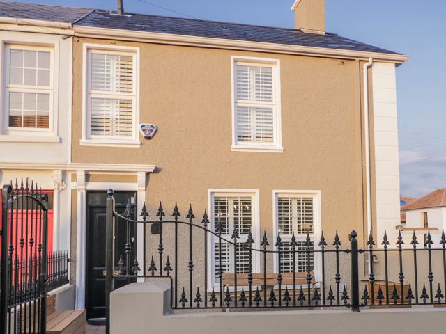 An exterior view of a house with a black door and windows at 41 Church view Portstewart