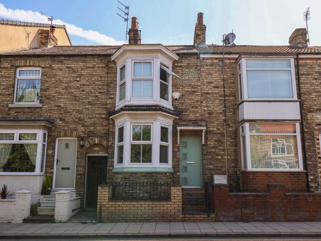 Front view of a house with brick facade and windows at 174 High Street in Marske-By-The-Sea