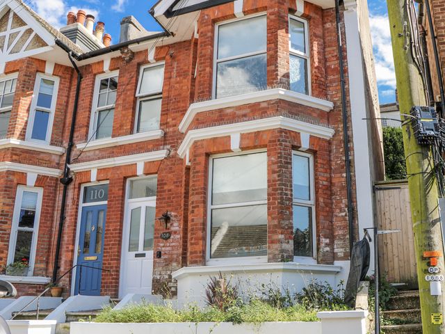 A brick exterior of a house with windows and a door at 108 Emmanuel Road Hastings