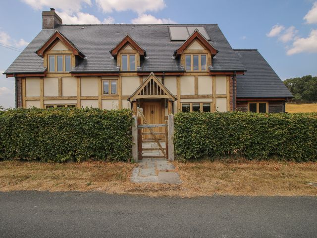 A house with a hedge and front door in Montgomery