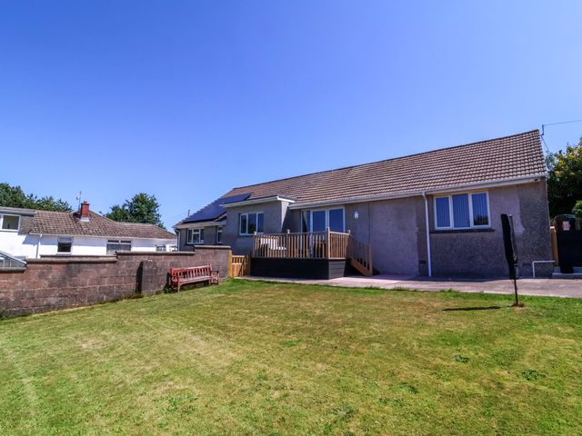 A house with a deck and lawn at West View Northlew near Hatherleigh