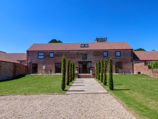 A house with trees and a pathway at Plot Four - Italian Terraced Garden Harpham near Nafferton