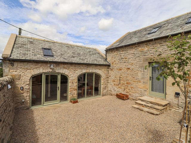 An outdoor area with stone building and gravel ground at West Dunkirk Hemmels Hexham