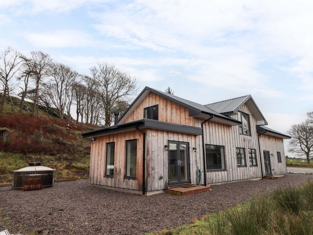 A house with windows and a door at Faodail House Portree