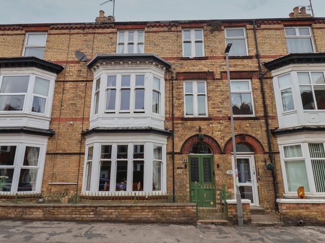 A front view of a multi-story brick building at 11 Rutland Street Filey