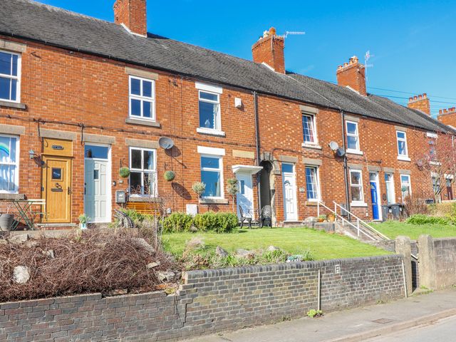 A row of brick houses with windows and doors in Ashbourne