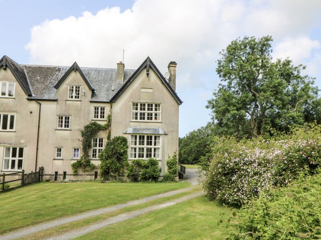 A house with windows and a pathway at Plas Pontfaen near Fishguard and Newport, Pembrokeshire