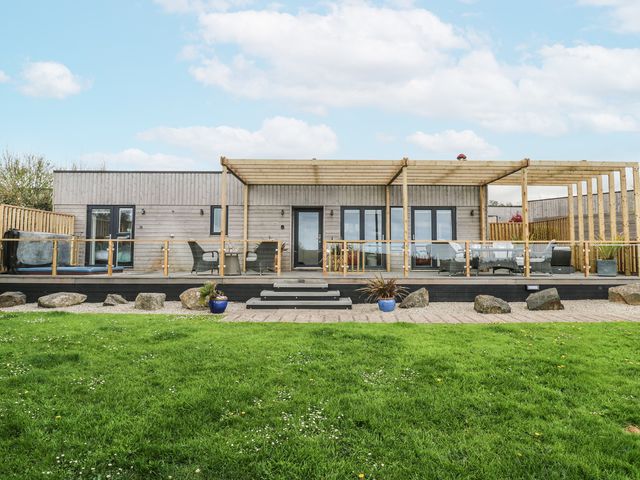 A house with deck and chairs at Petroc in Portreath