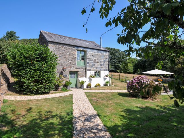 A house with a garden and pathway at The Mill in Lostwithiel