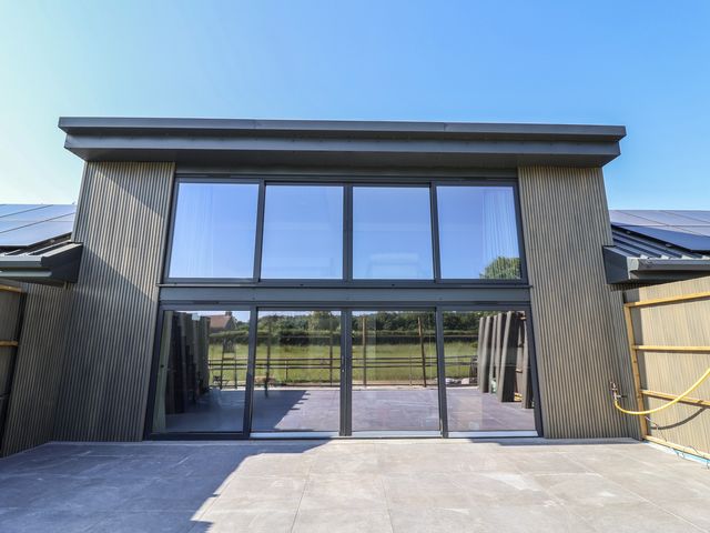 A modern building exterior with large windows at Number 7 in Bishop Sutton